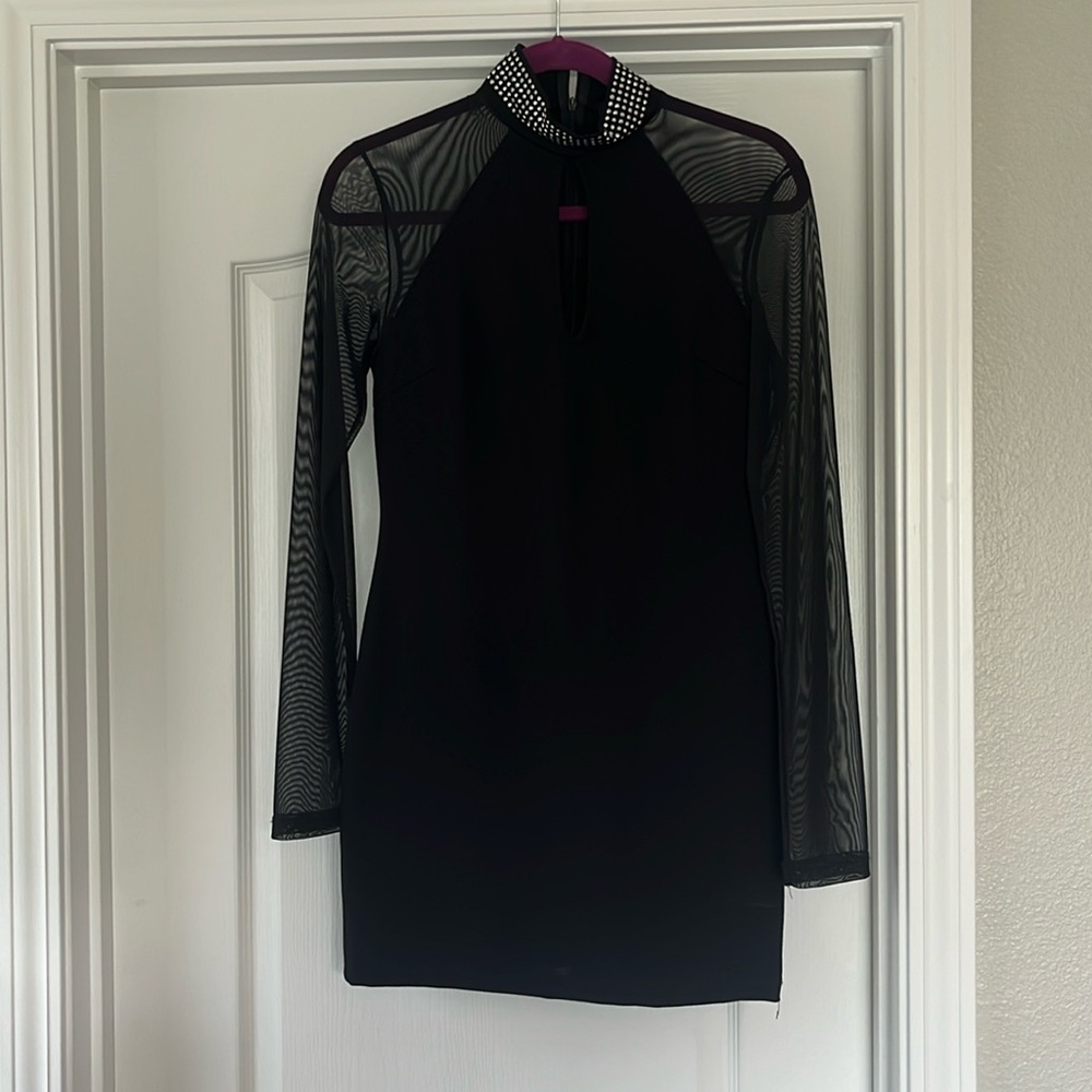 Women’s black sheer long sleeve minidress. New with tags. High beaded collar.